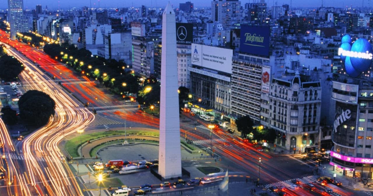 Night cityscape of Buenos Aires Obelisk with light trails