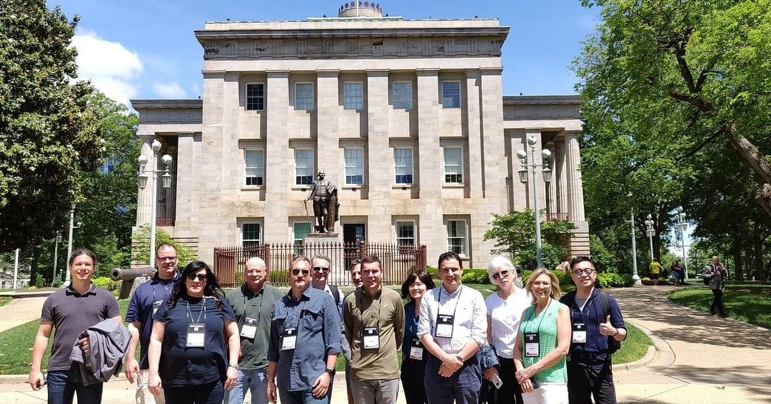 Tour group on courthouse lawn, historic walking tour outdoors