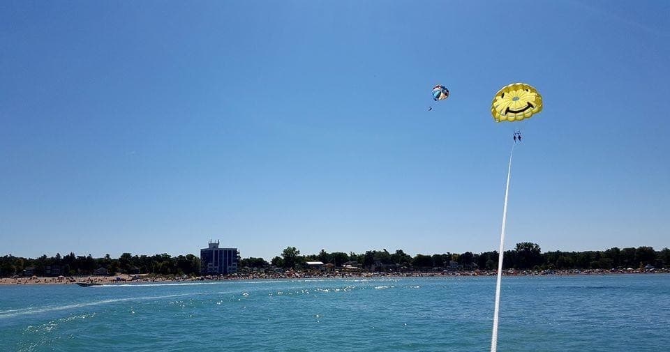 Parasail soaring over blue Lake Huron near Grand Bend beach