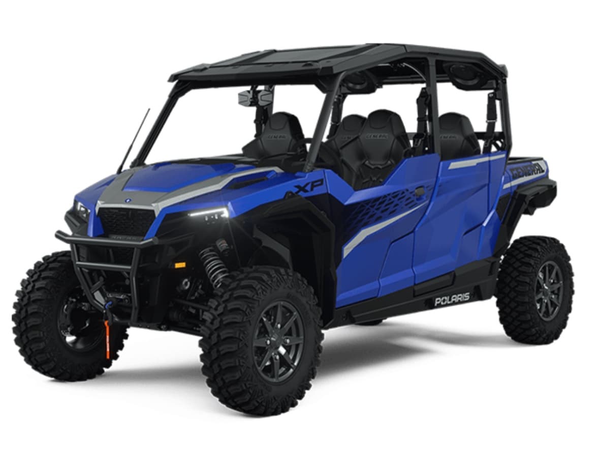 Blue Polaris UTV off-road vehicle on white studio backdrop