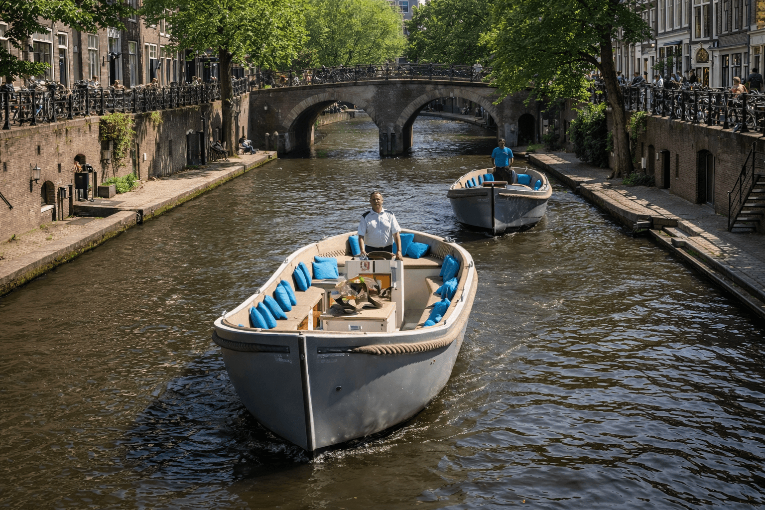 Electric boat cruising a historic Utrecht canal under bridge