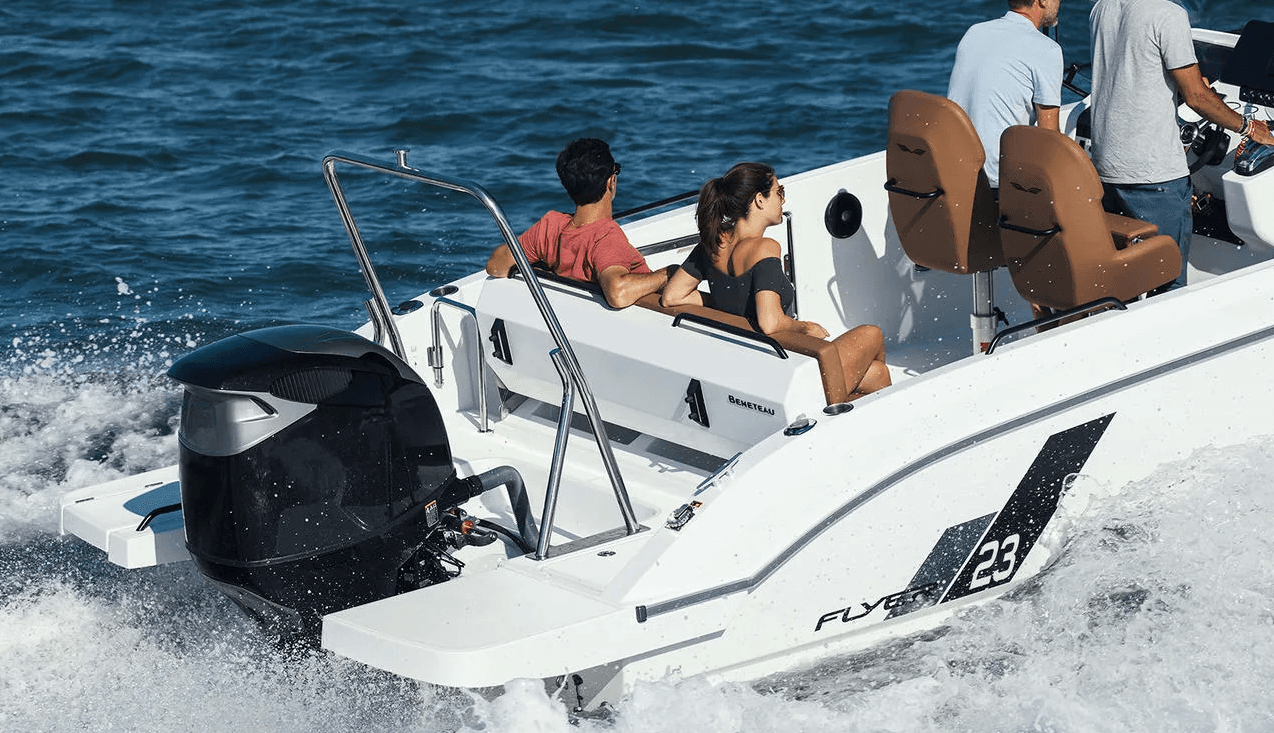 High-speed rigid inflatable boat powering across open ocean water