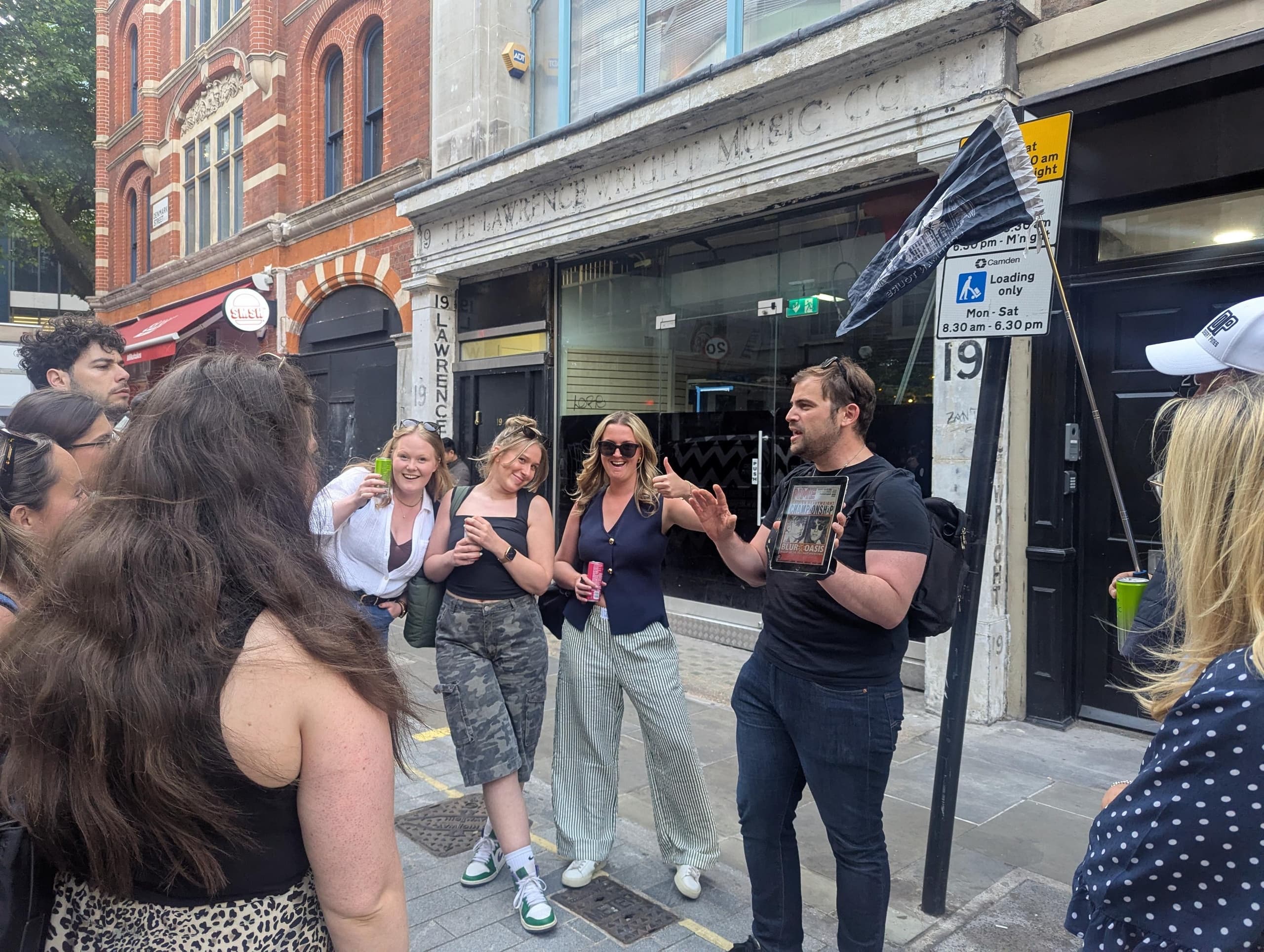 Small group listening to tour guide on central London walking route