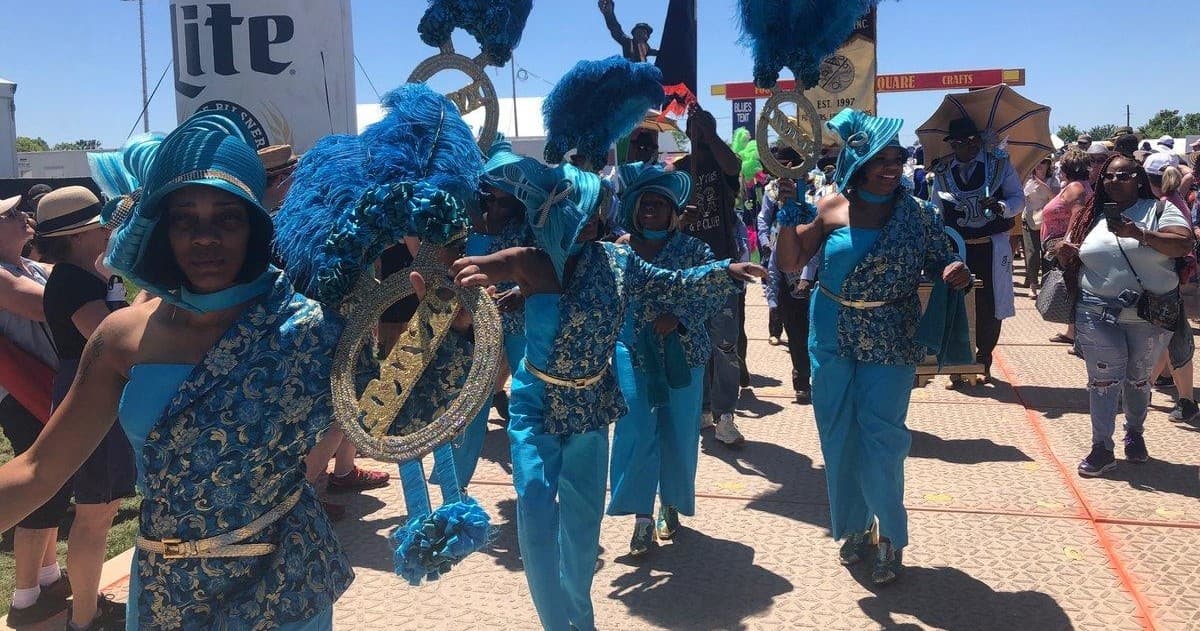 Mardi Gras second line parade with brass band in New Orleans