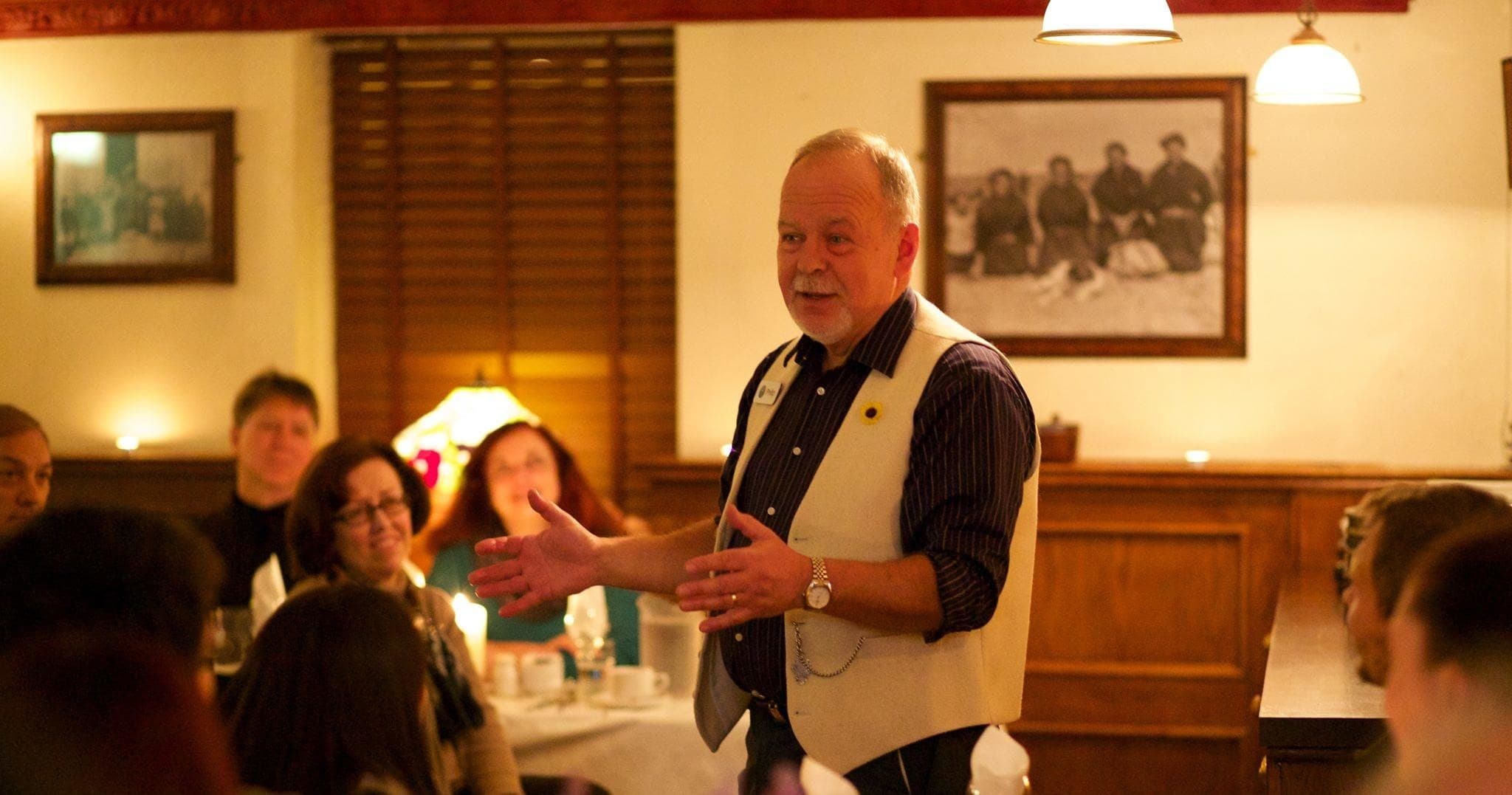 Elder storyteller sharing Irish tales inside historic Dublin pub