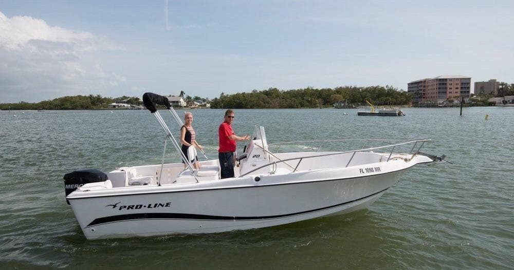 Center console boat on open coastal water with anglers