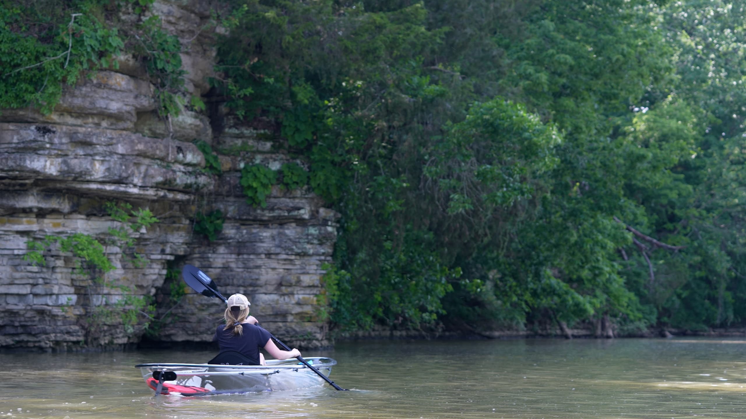 Kayaker paddling near limestone cliffs on Old Hickory Lake