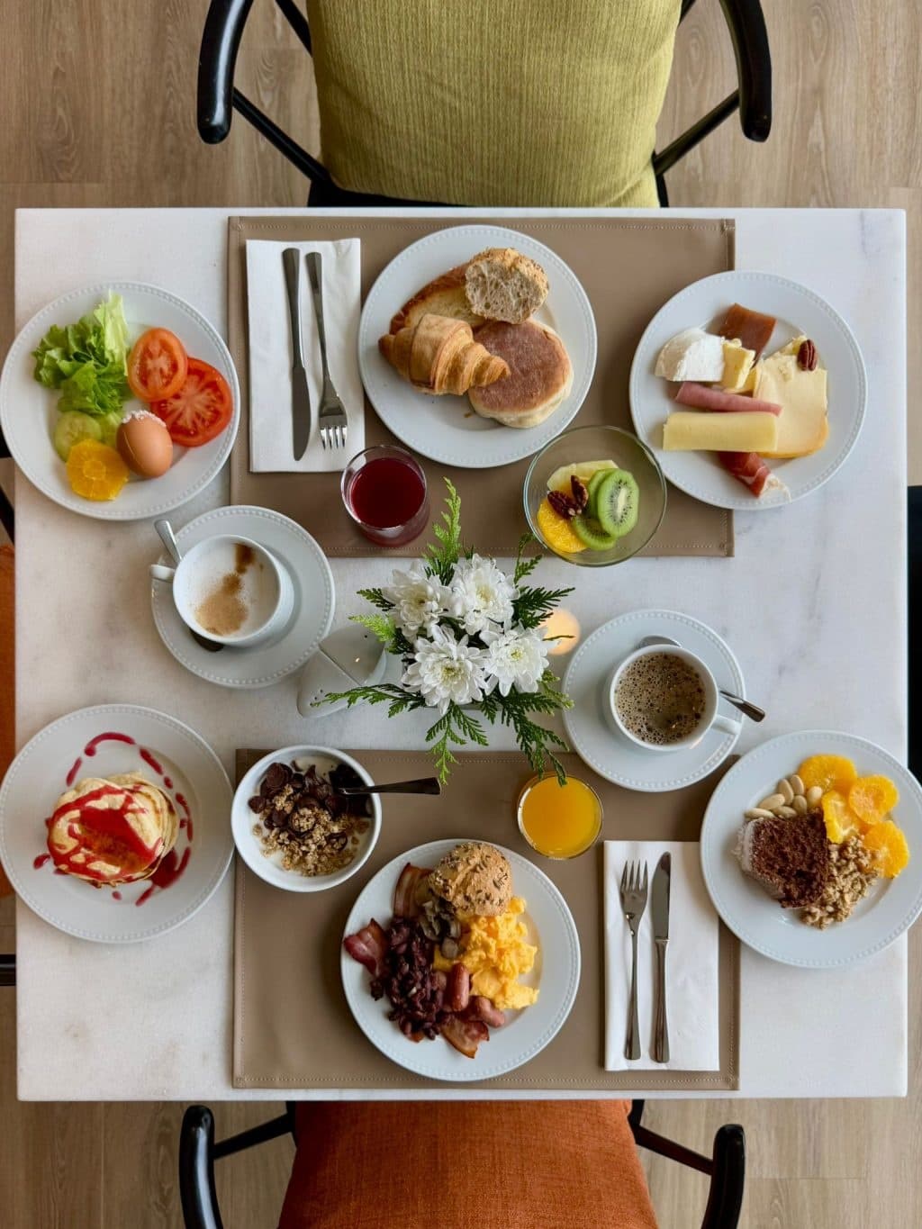 Continental breakfast spread on villa dining table indoors