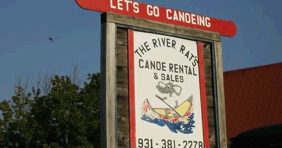 Canoe rental sign at River Rat outfitter near river access