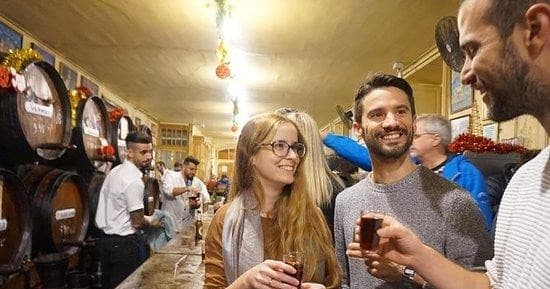 Small-group barrel wine tasting indoors at traditional bodega