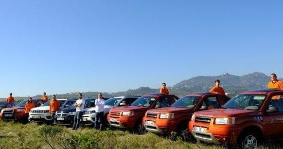 Off-road 4x4 vehicles lined up for guided adventure tours in countryside