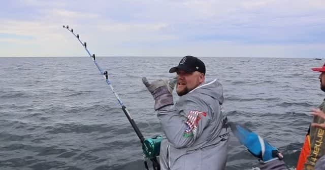 Angler fighting big fish offshore on ocean charter in Massachusetts