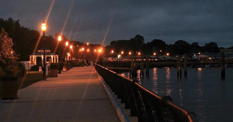 Evening waterfront promenade walk along Jersey Shore harbor