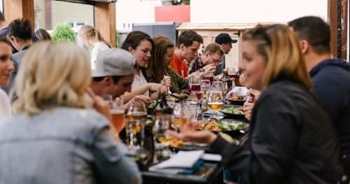 Group dining indoors on guided Franklin food tasting tour