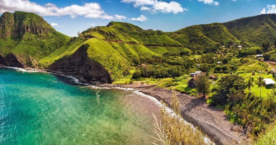 Lush green coastal bay with turquoise water, scenic island vista