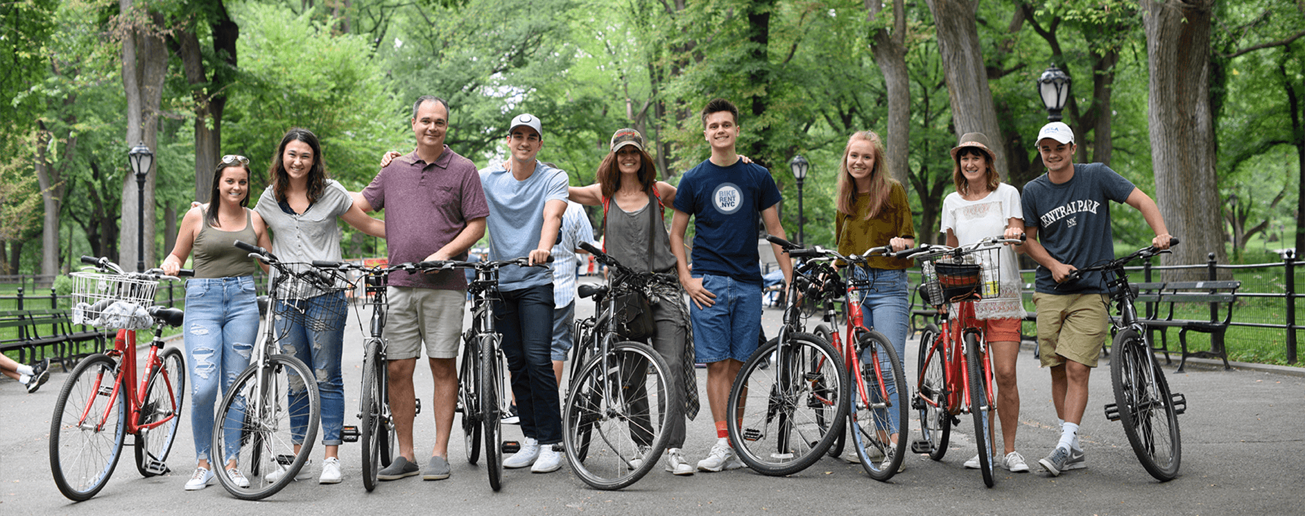 Cycling group preparing for Manhattan bike tour in park