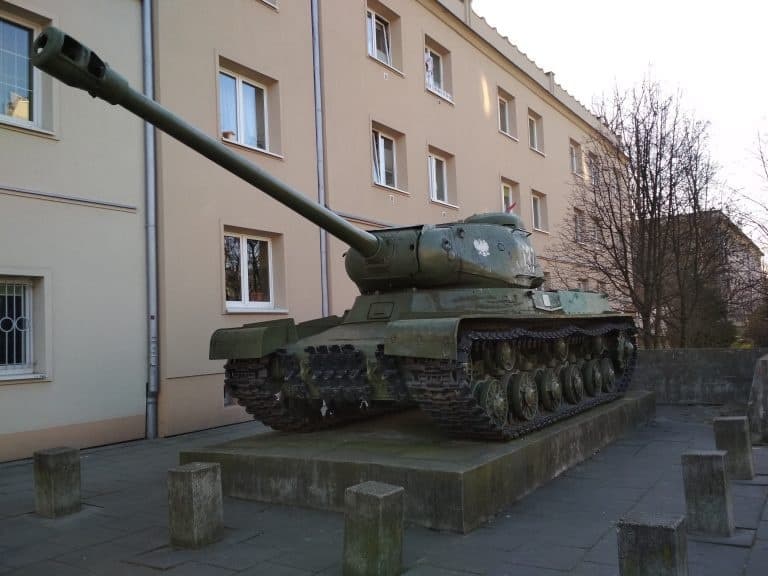 Soviet tank monument displayed on urban plaza, outdoor history site