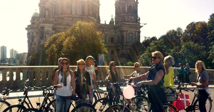 Group bike tour cycling near Berlin cathedral, urban bike experience