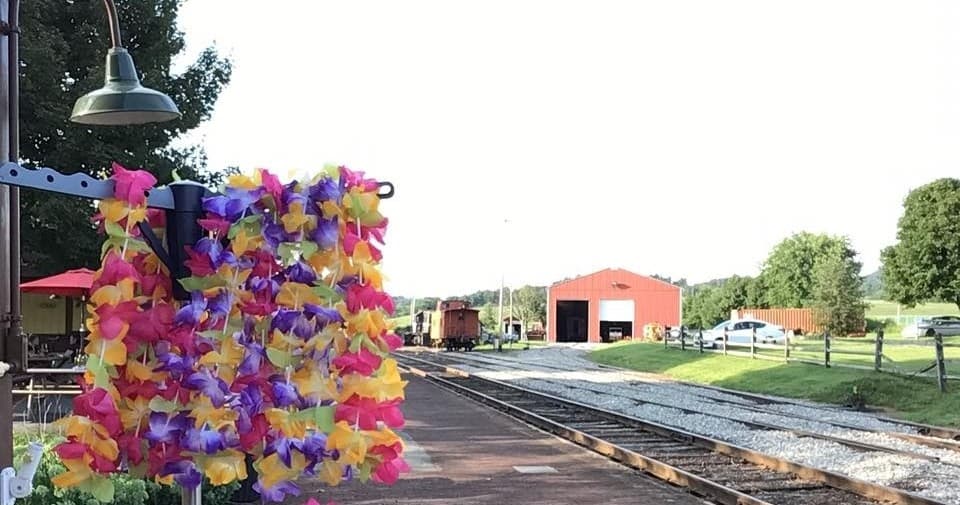 Railway platform with colorful leis at rural train station