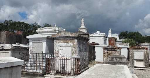 Above-ground tombs in New Orleans cemetery on daytime walking tour