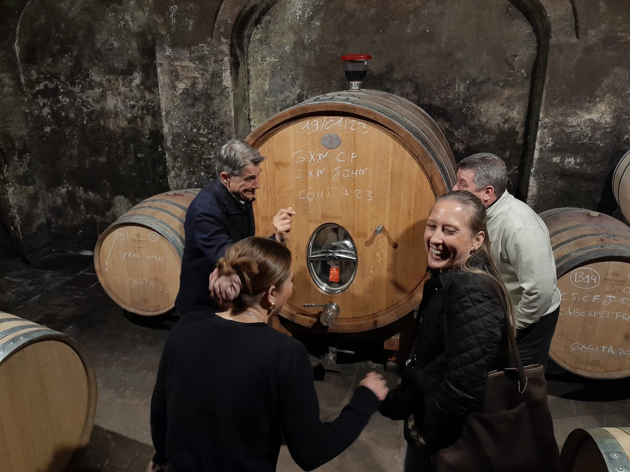 Winery cellar tour with group sampling from large oak cask