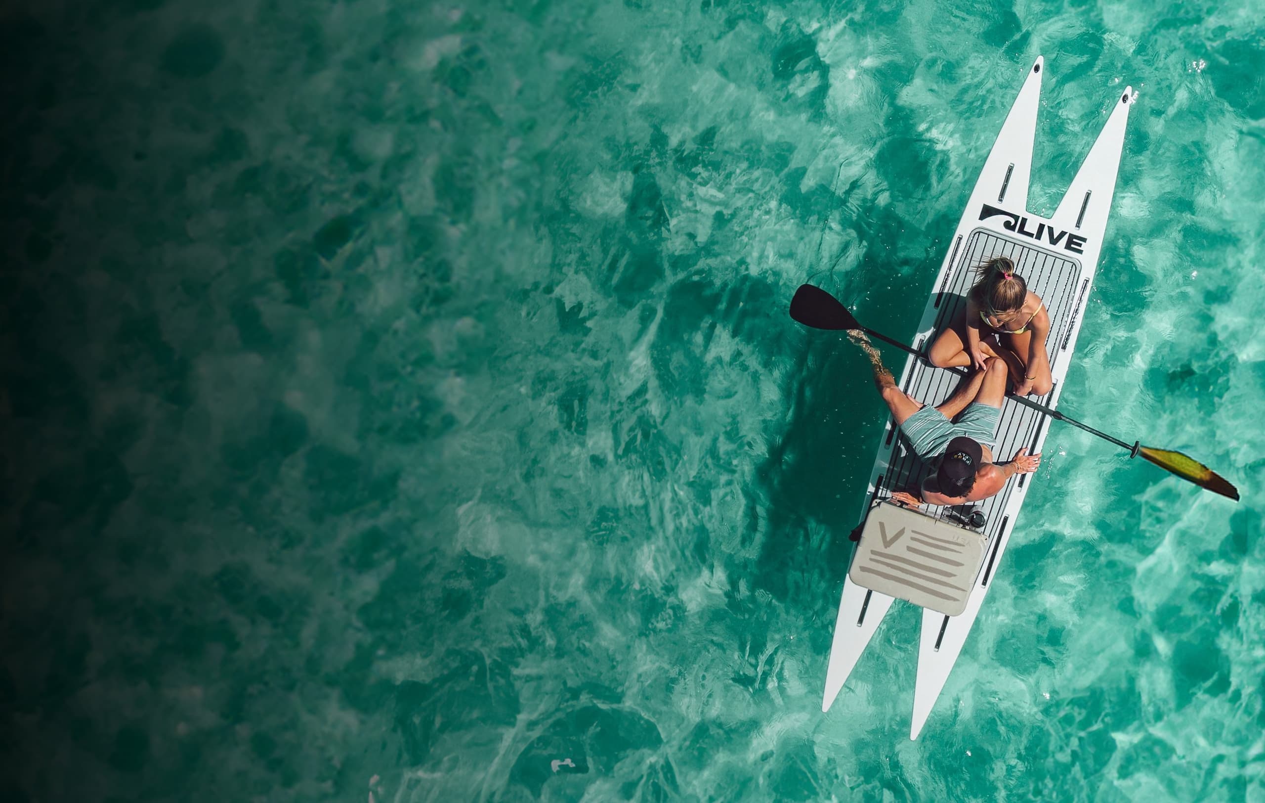 Water Activities & LIV Adventures: Paddleboard Fun in Emerald Waters