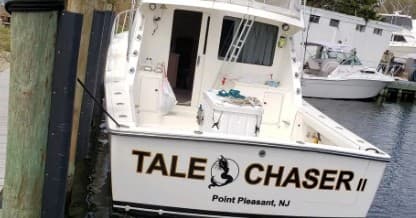Tale Chaser II sportfishing boat docked at Point Pleasant marina