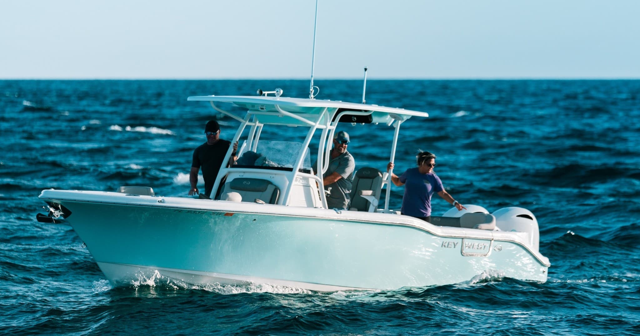 Fishing charter boat cruising on open ocean with passengers