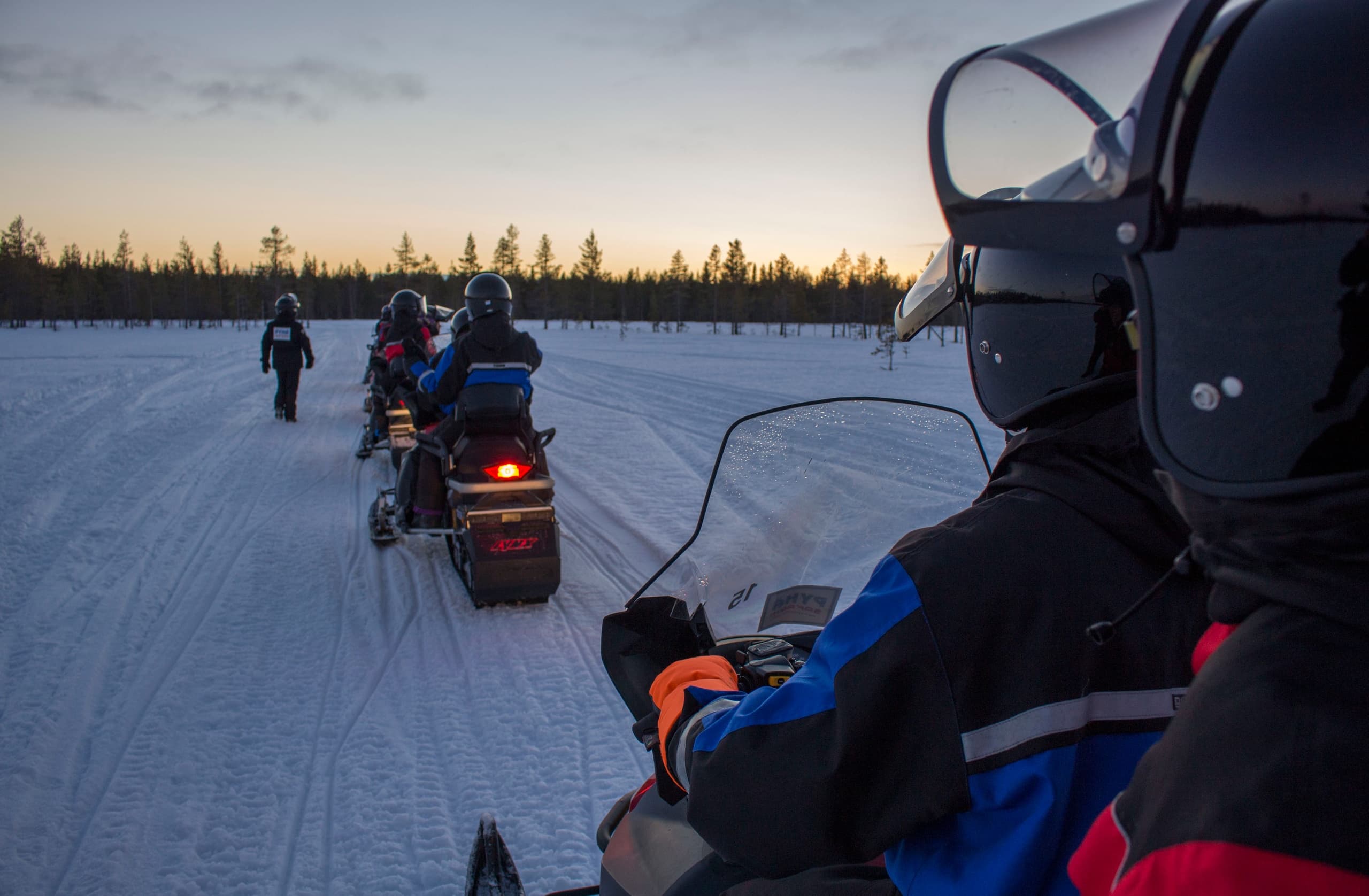 Experience the Northern Lights on an Evening Snowmobile Safari at Pyhä Fell