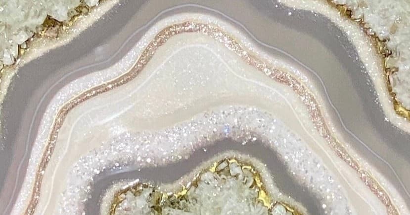 Close-up agate-style resin art slab with glittery layers