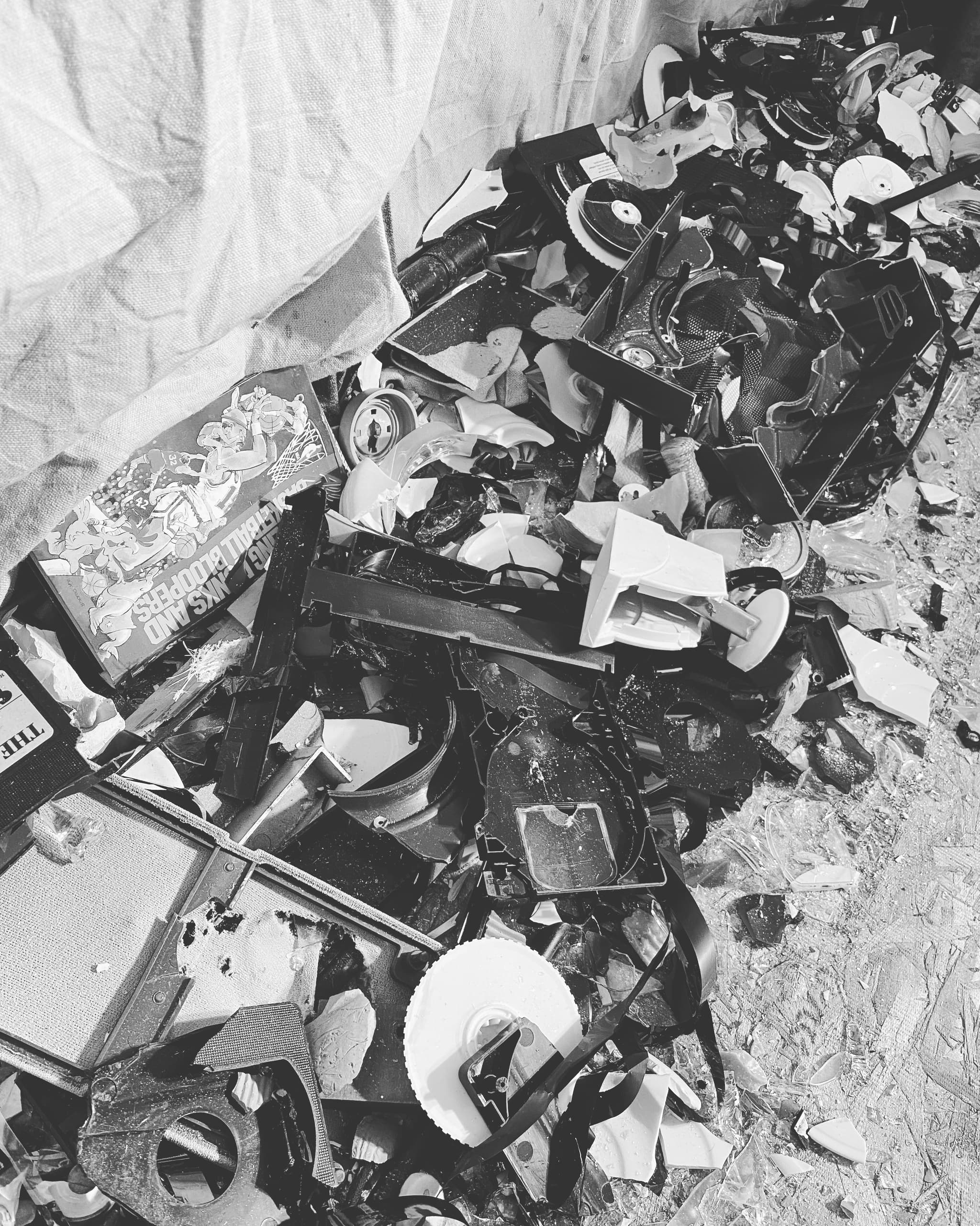 Pile of smashed electronics and ceramics from rage room cleanup