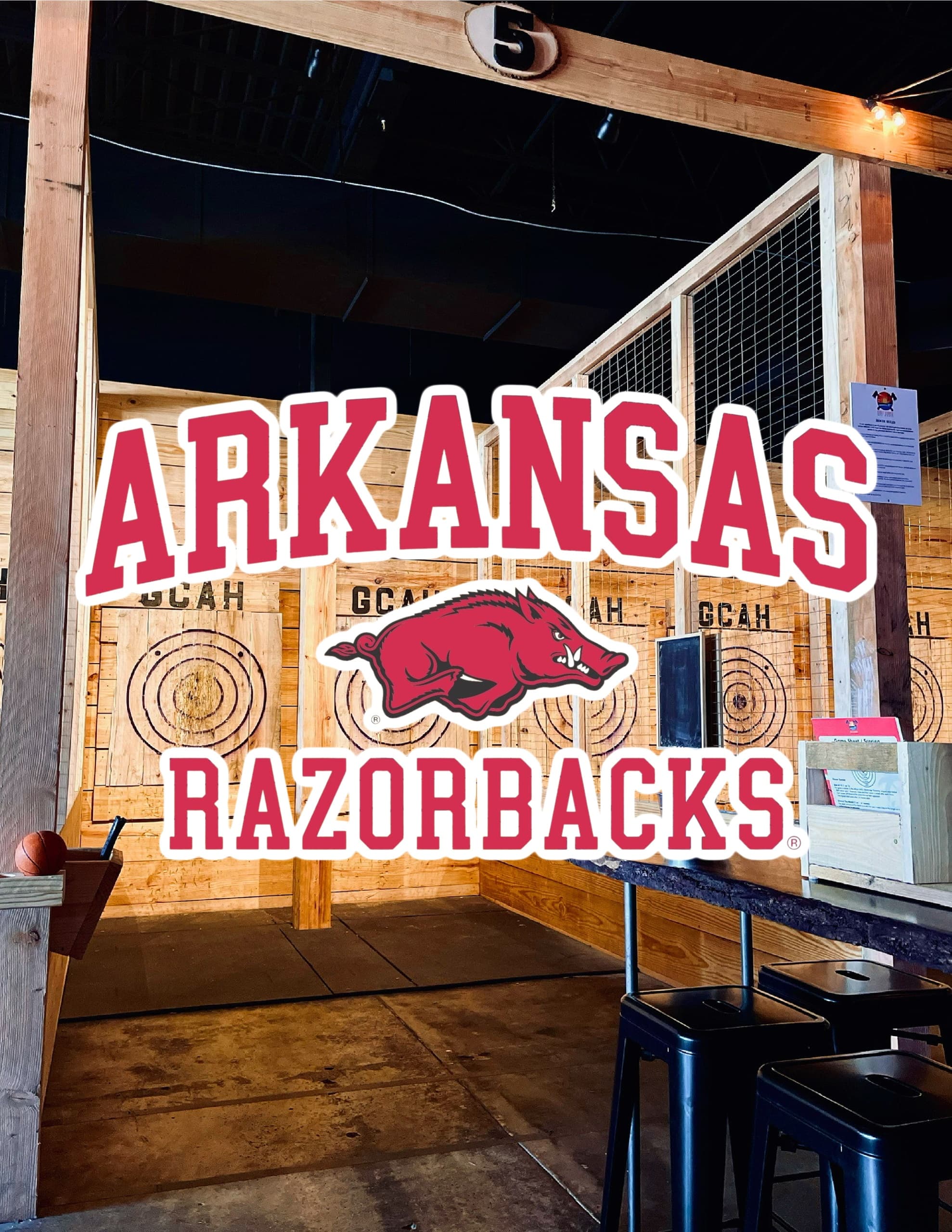 Arkansas Razorbacks themed indoor axe-throwing lane and decor