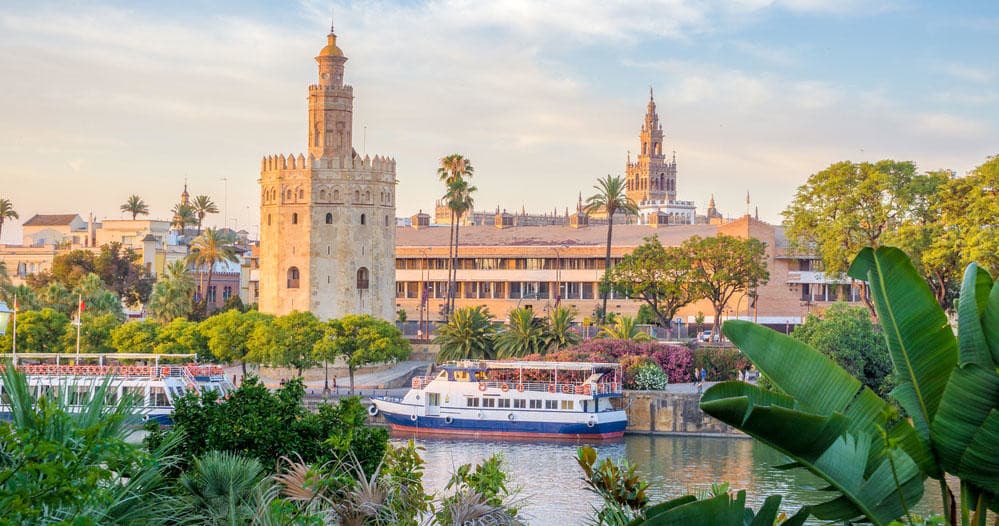 Torre del Oro and Guadalquivir river with tour boats