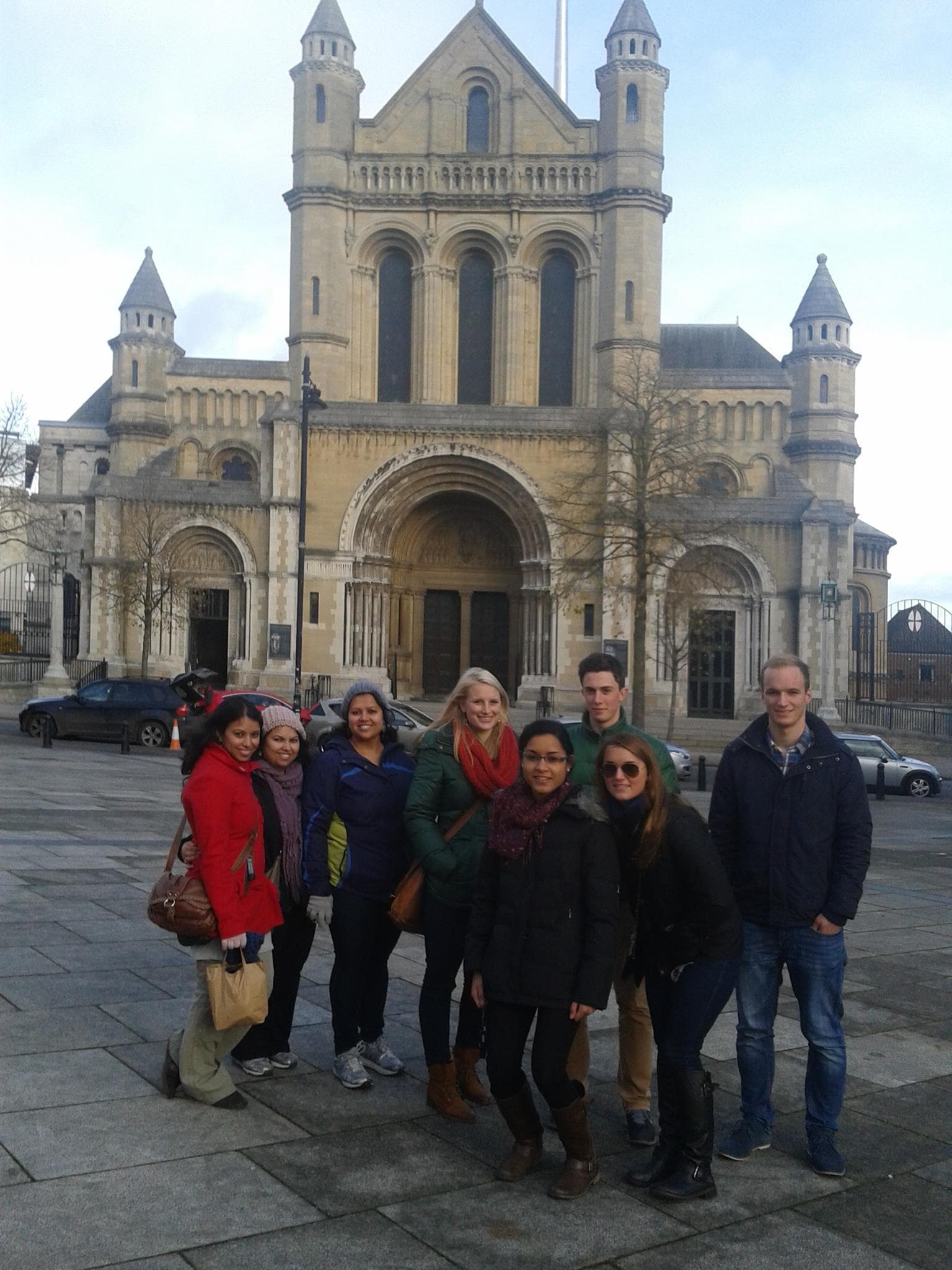 Guided walking tour group outside historic Belfast cathedral