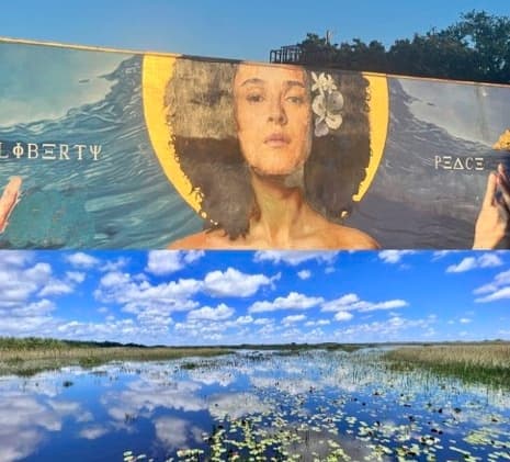 Coastal marsh panorama with mural art above scenic wetlands