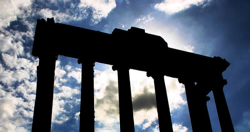 Silhouetted Roman temple columns at sunrise, Forum view