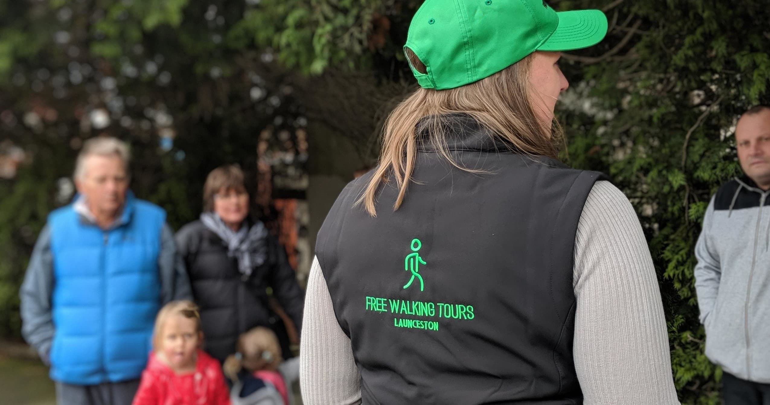 Tour guide wearing Free Walking Tours vest in Launceston park