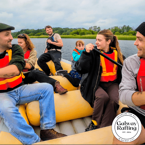 Group rafting on calm river near Galway wetlands, people paddling
