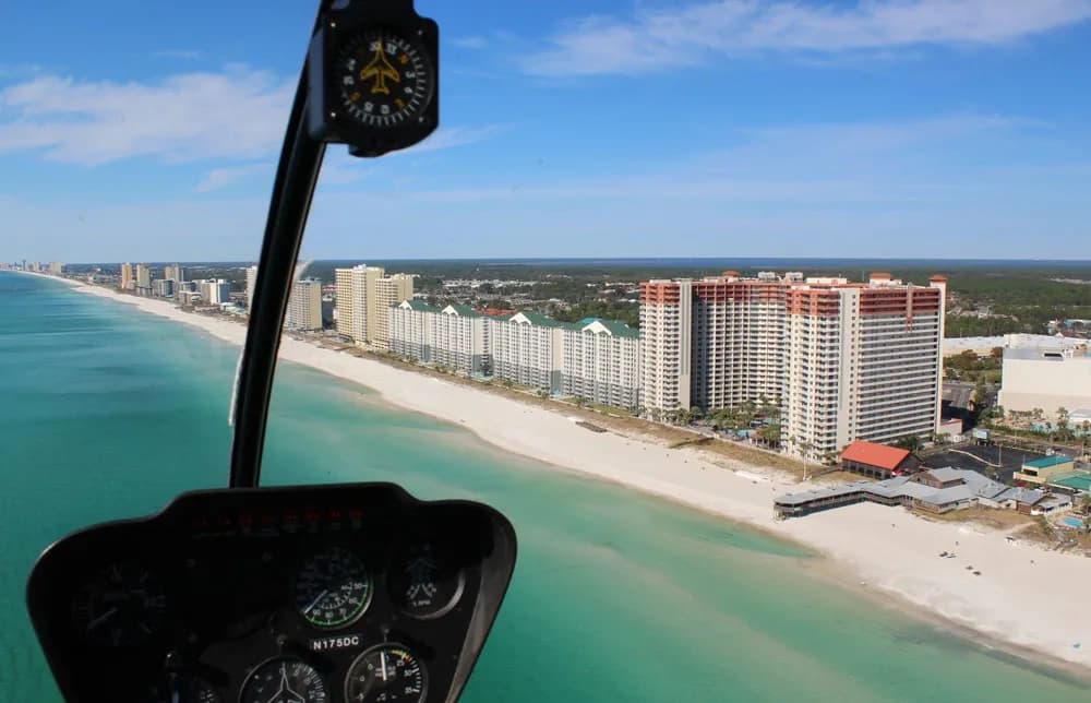 Cockpit view watching Gulf shoreline and high-rise beach resorts