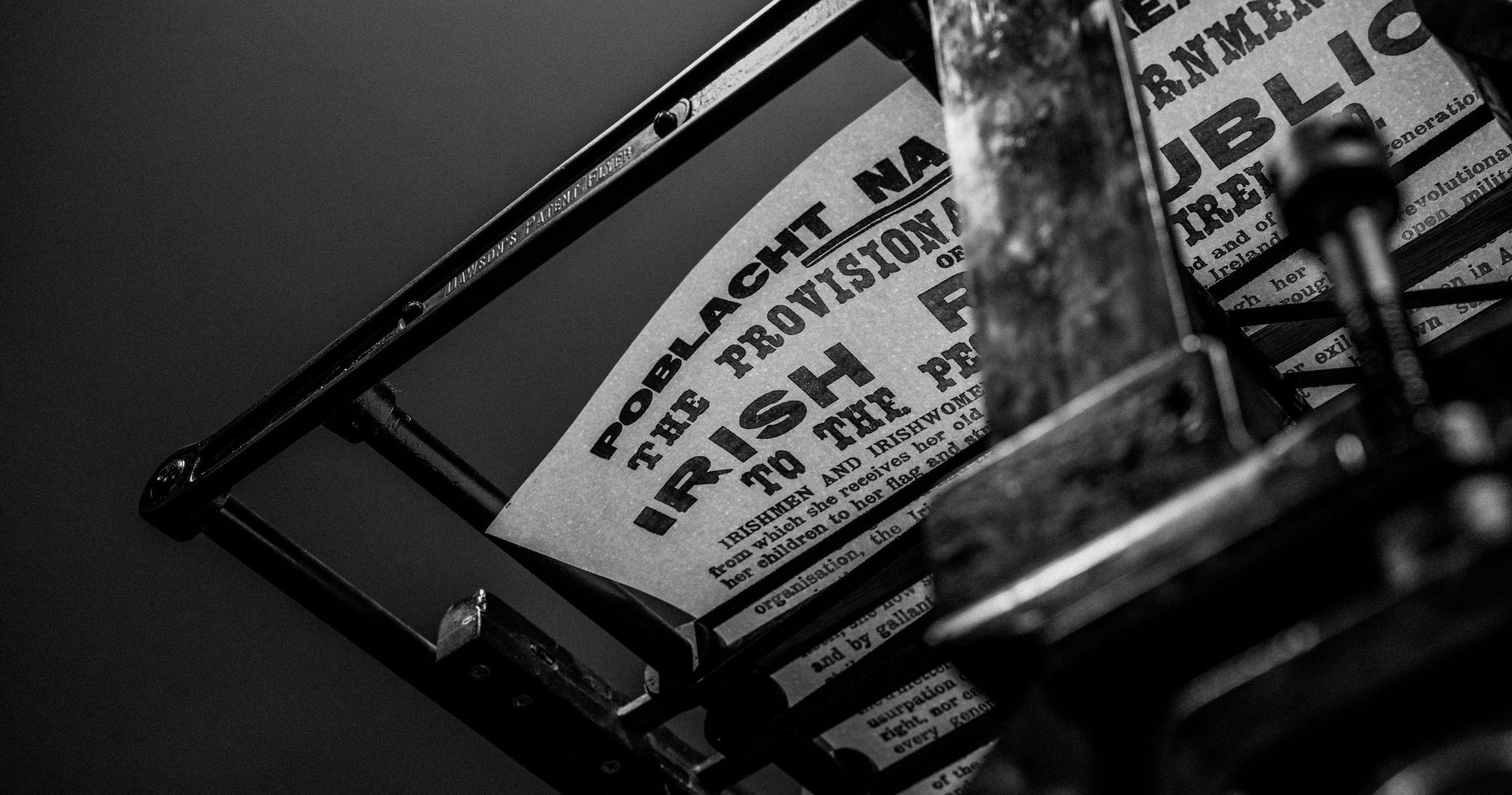 Close-up vintage printing press in monochrome at National Print Museum