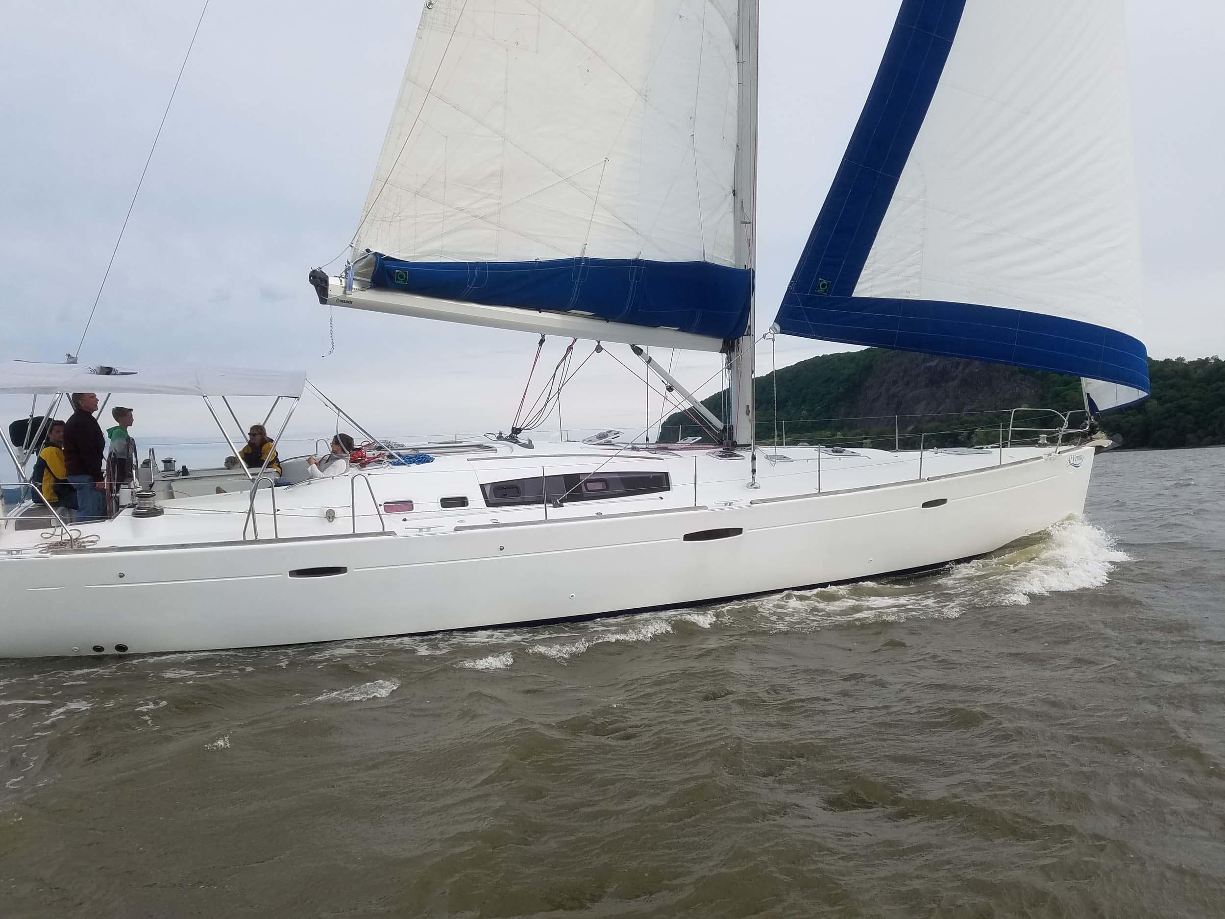 Close-up white sailboat under blue sky on the Hudson River