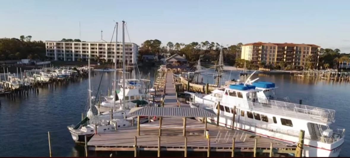 Aerial view of marina docks and boats at Hudson Marina harbor