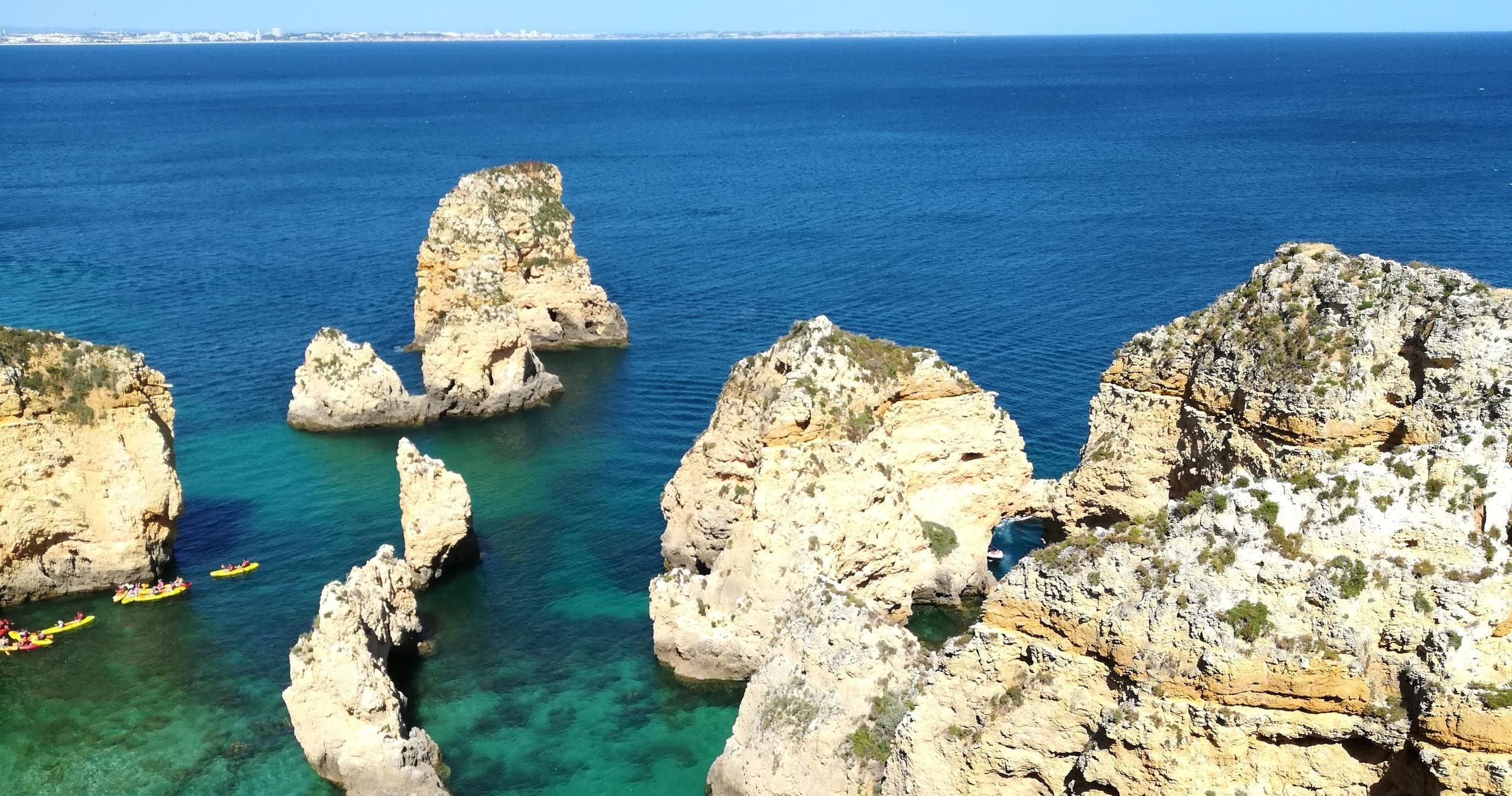 Dramatic coastal cliffs and turquoise sea, Algarve Portugal