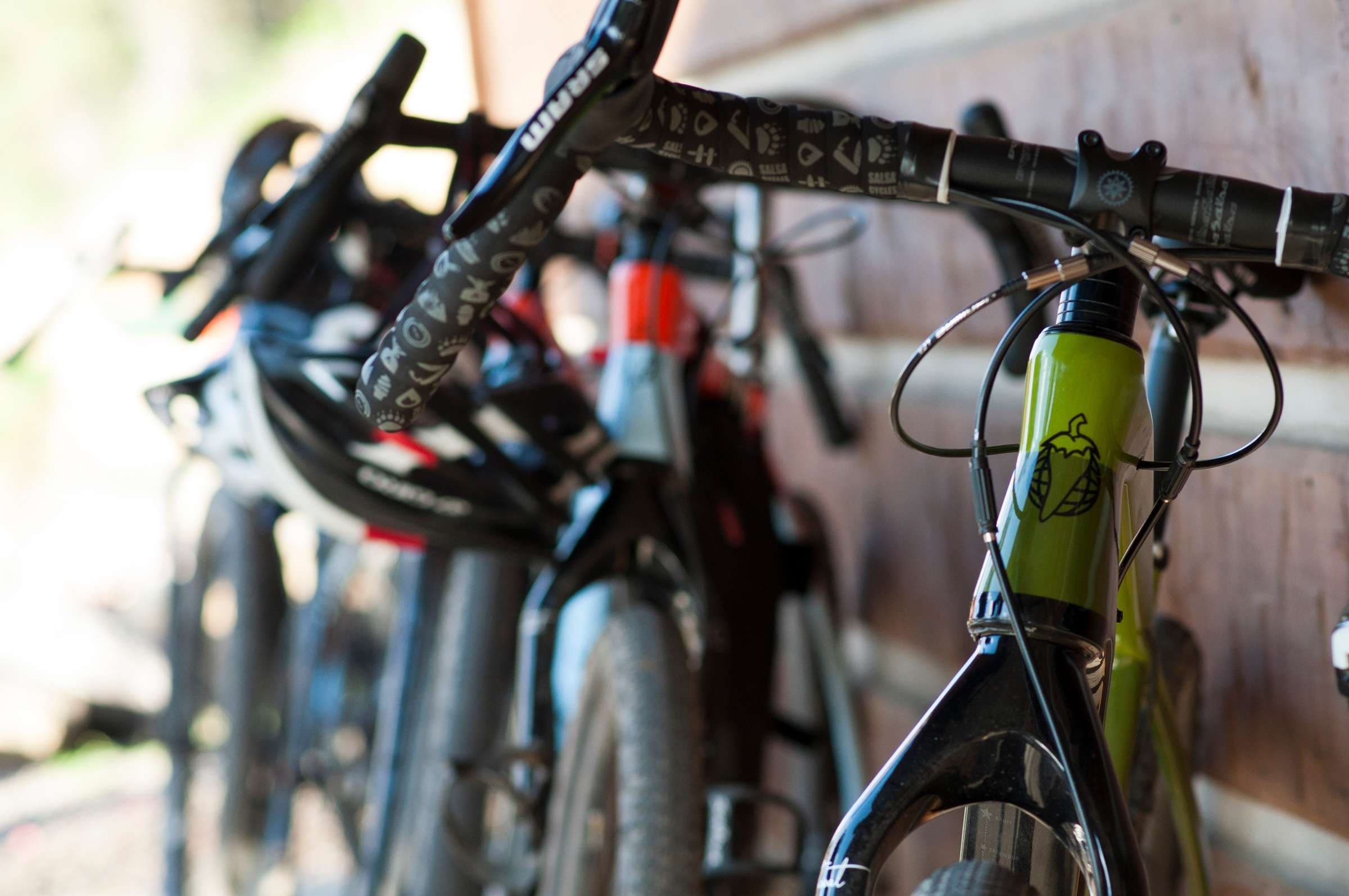 Mountain biker shredding a leaf‑strewn technical forest trail