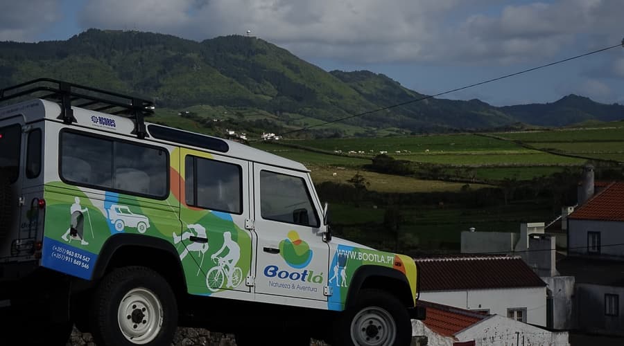 Bootla off-road vehicle overlooking scenic green hills and valleys