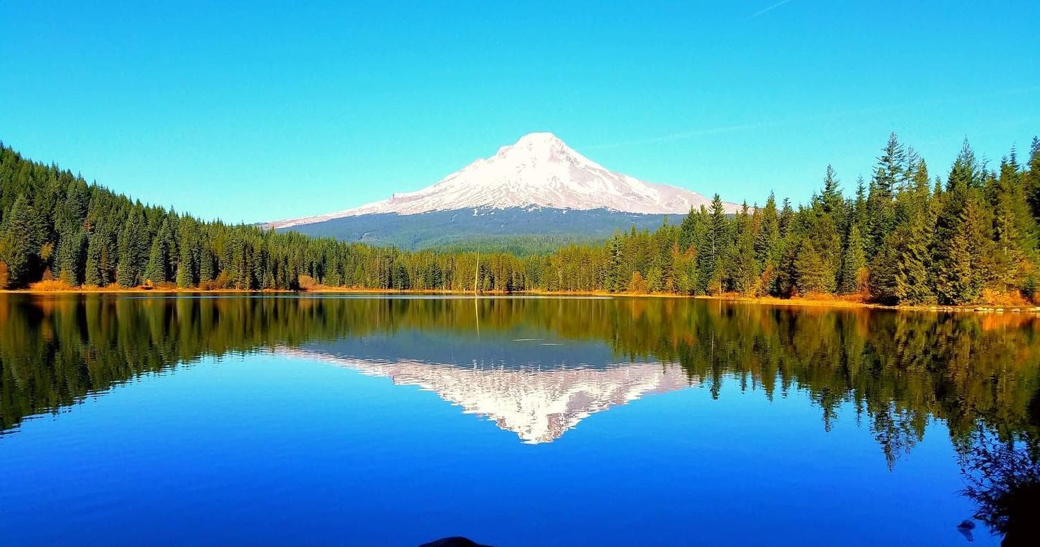 Mirror-like alpine lake reflection, mountain hiking and photography