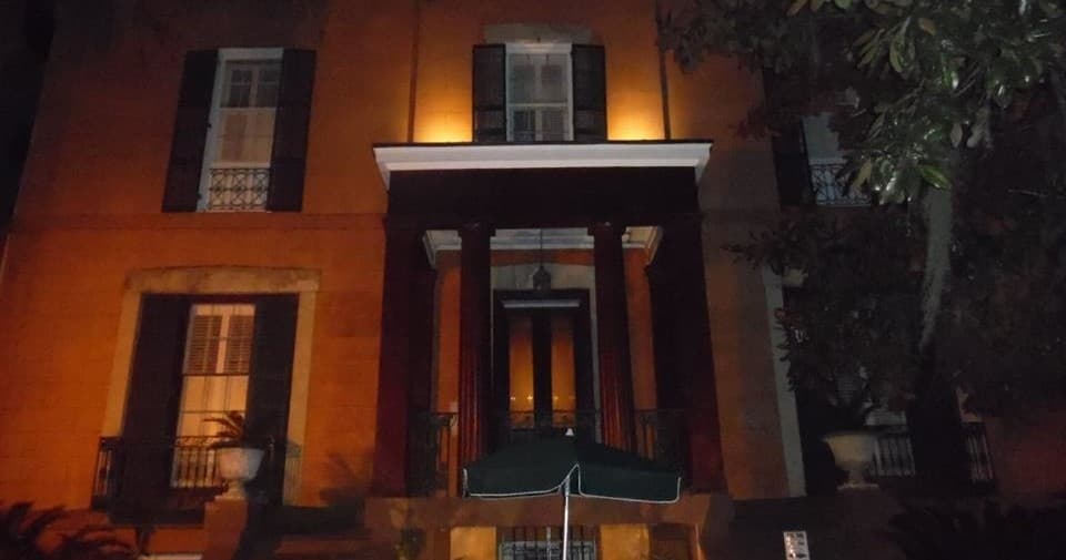 Illuminated historic building facade at night on St. Augustine ghost walk