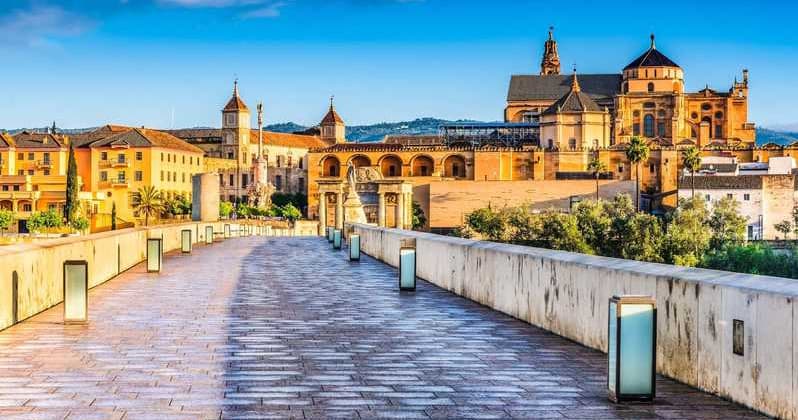 Historic stone bridge walkway leading to Mezquita-Catedral in Córdoba