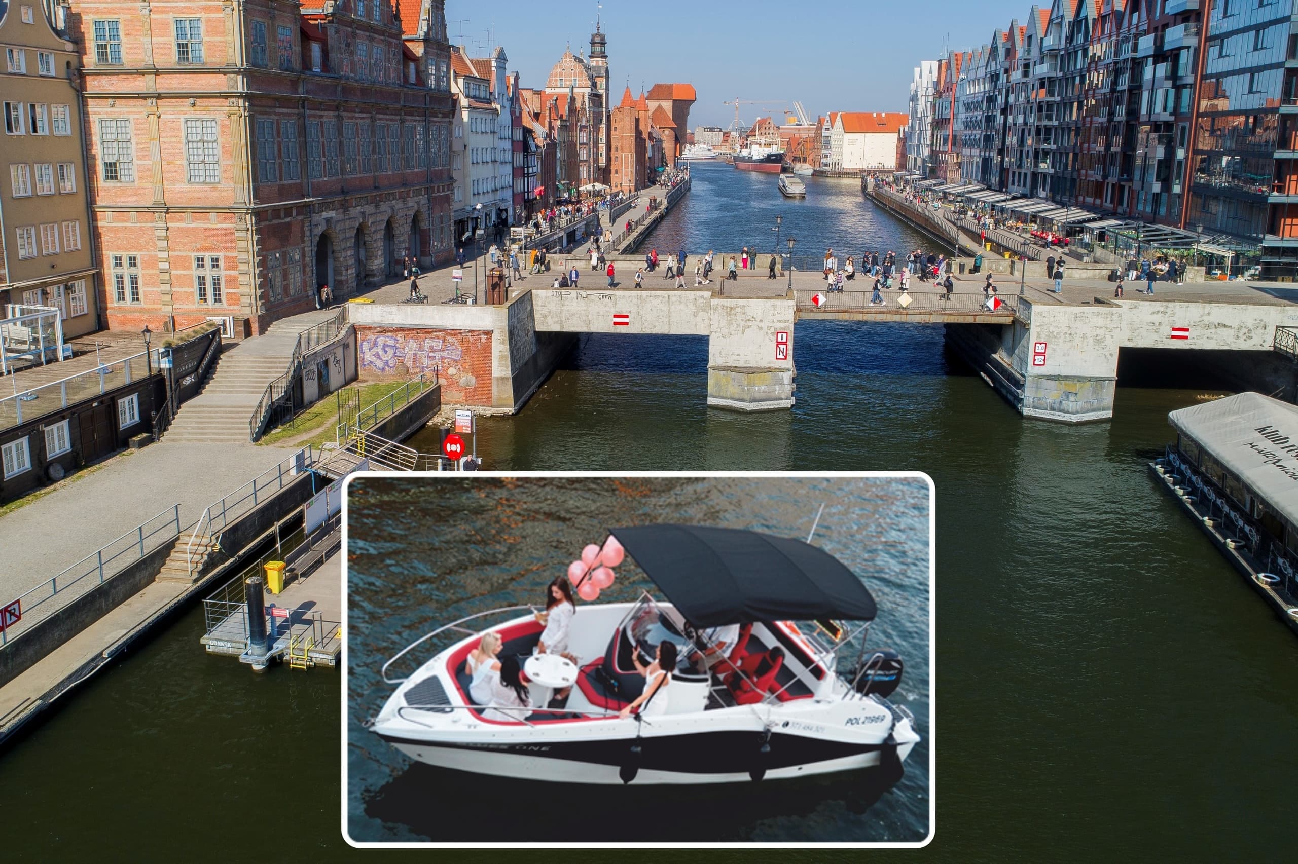 Motorboat tour on urban canal with city waterfront