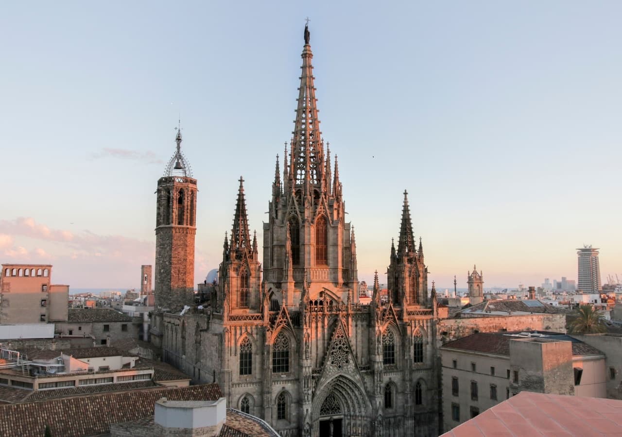 Barcelona cathedral spires at sunset, panoramic city landmark